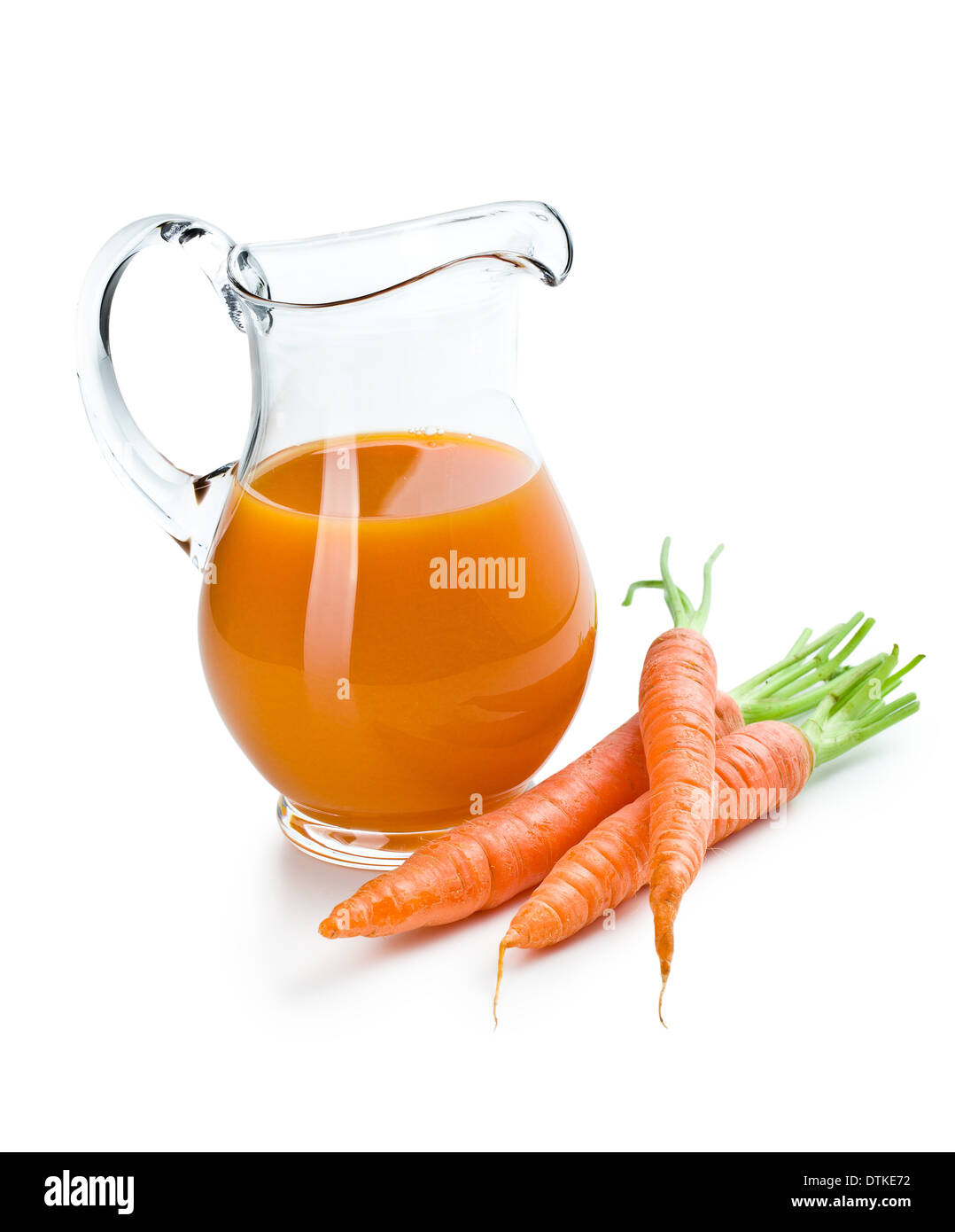 the carrot juice in pitcher with carrots Stock Photo