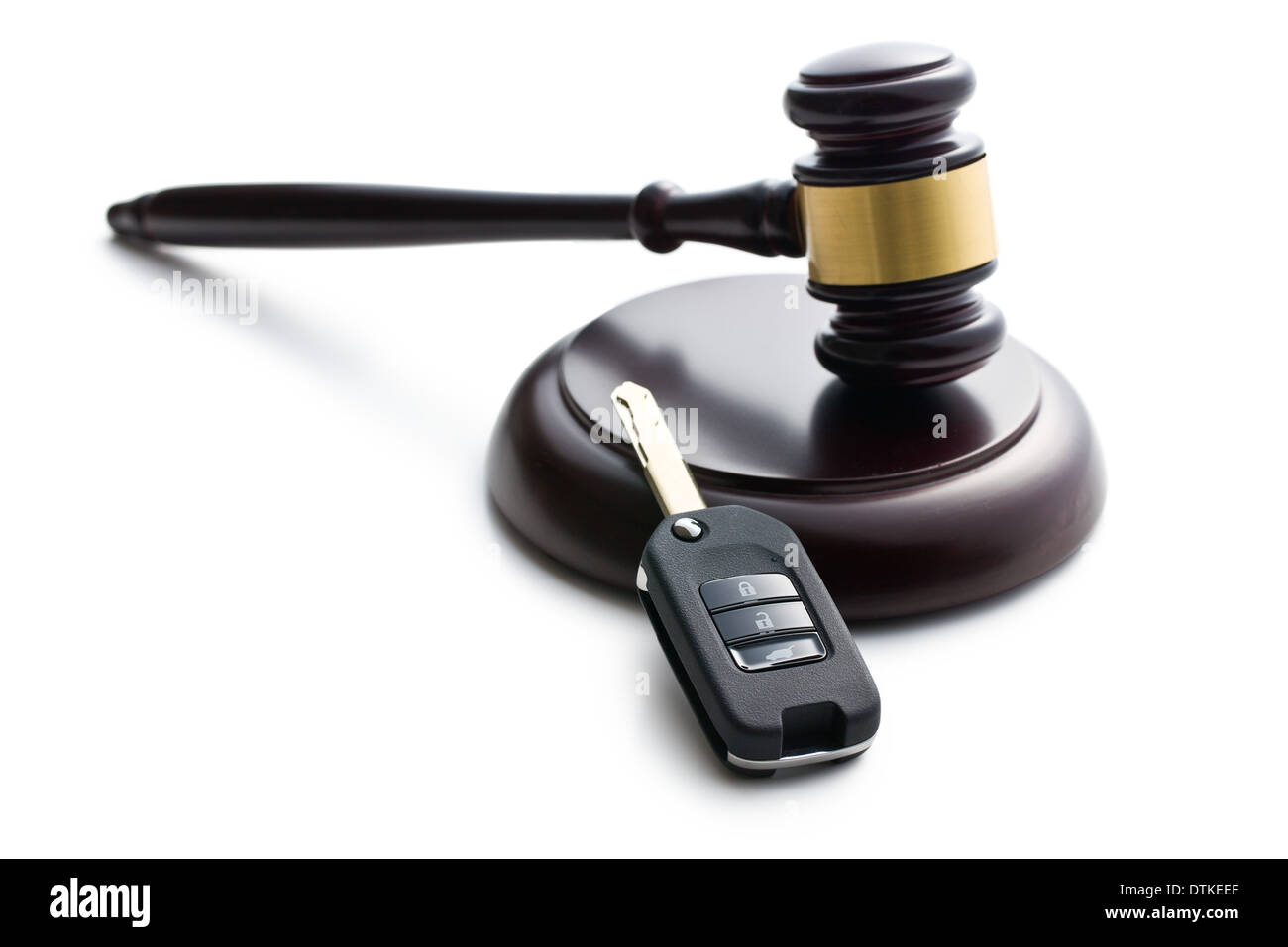car key and judge gavel on white background Stock Photo