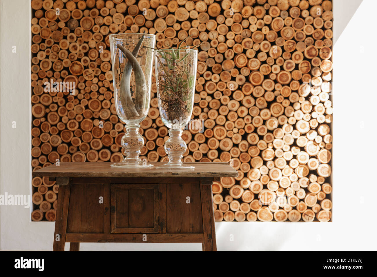 Vases and wooden logs in modern house Stock Photo