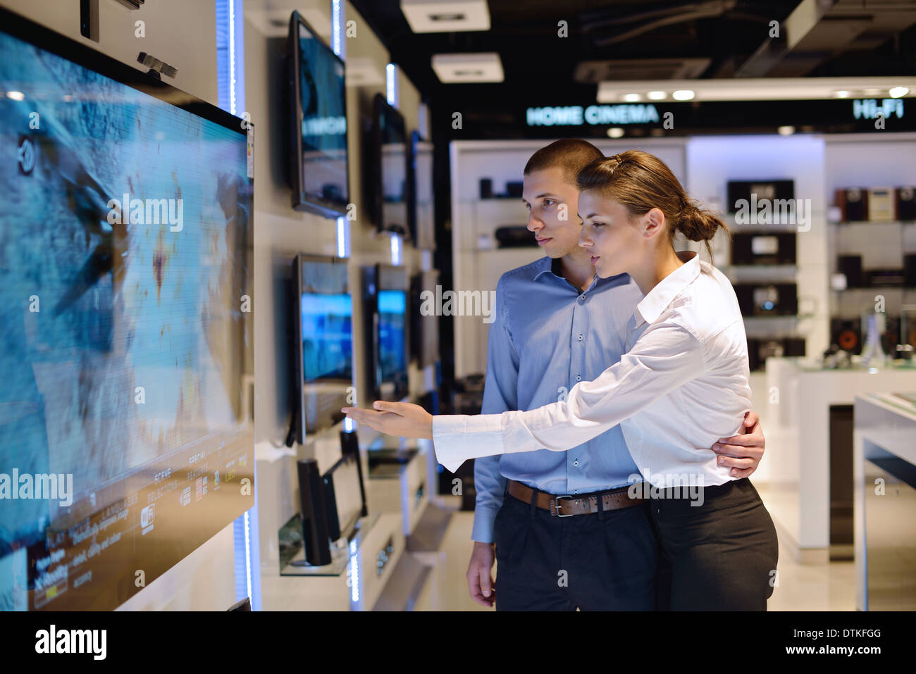 Young couple in consumer electronics store Stock Photo