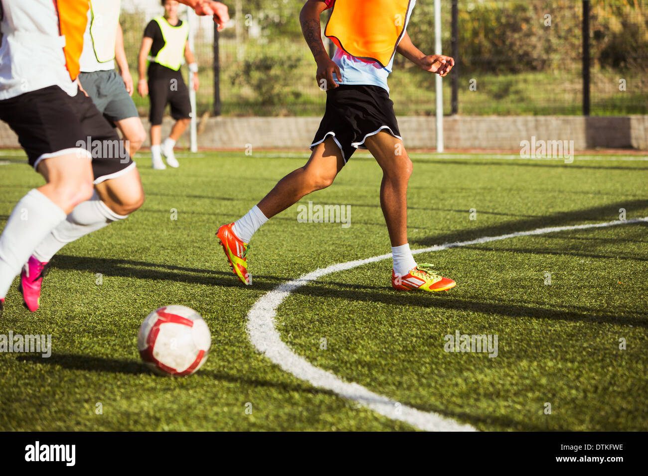 Soccer players training on field Stock Photo