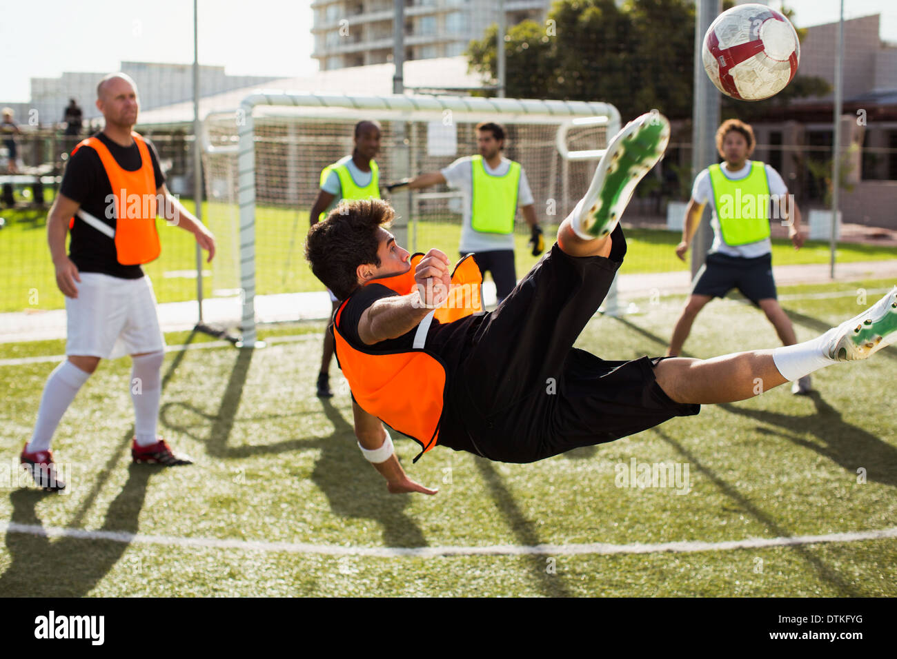 Soccer players training on field Stock Photo