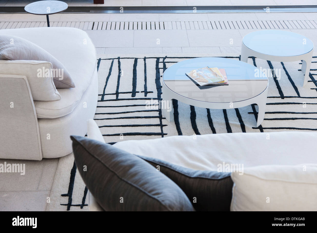 Sofa and coffee tables in modern living room Stock Photo - Alamy