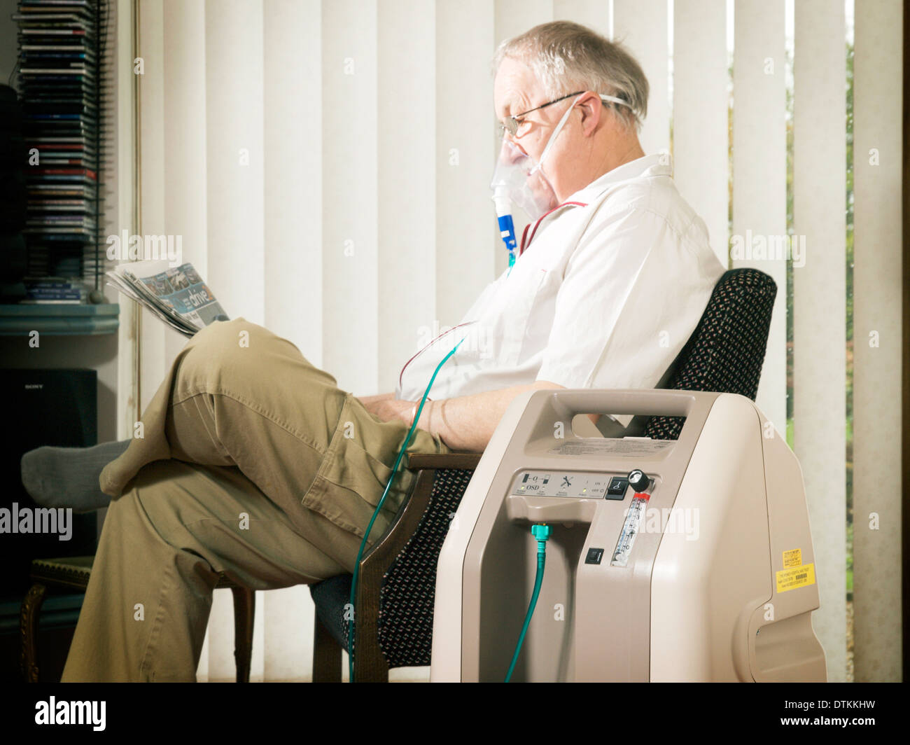 Patient using Oxygen Concentrator in their home Stock Photo