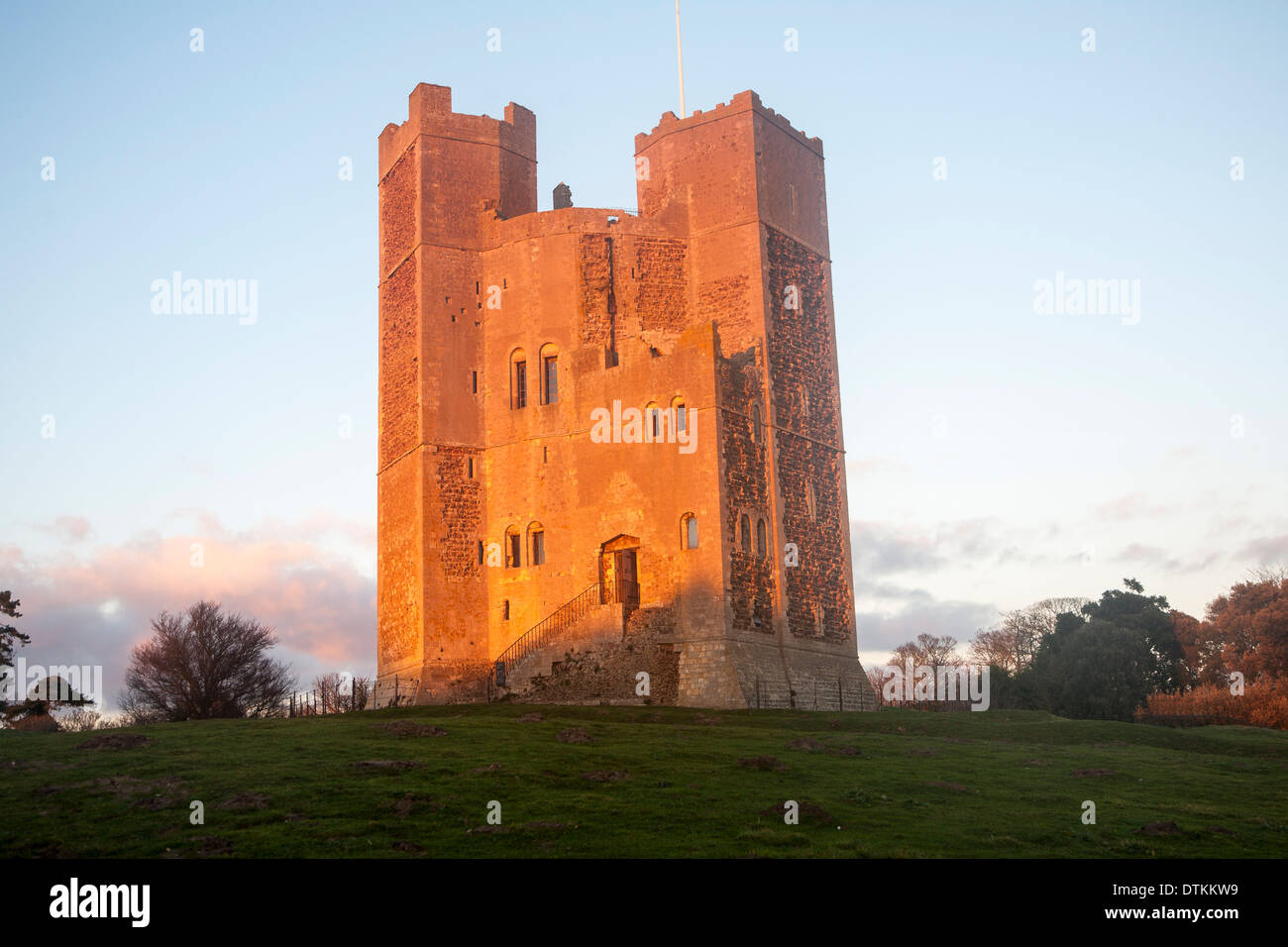 Late afternoon winter sunshine shining on walls of Orford Castle, Orford, Suffolk, England Stock Photo