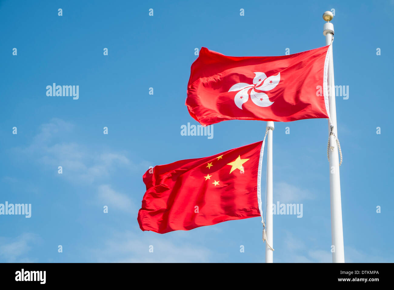 Flags of China and Hong Kong flying on flagpoles Stock Photo Alamy