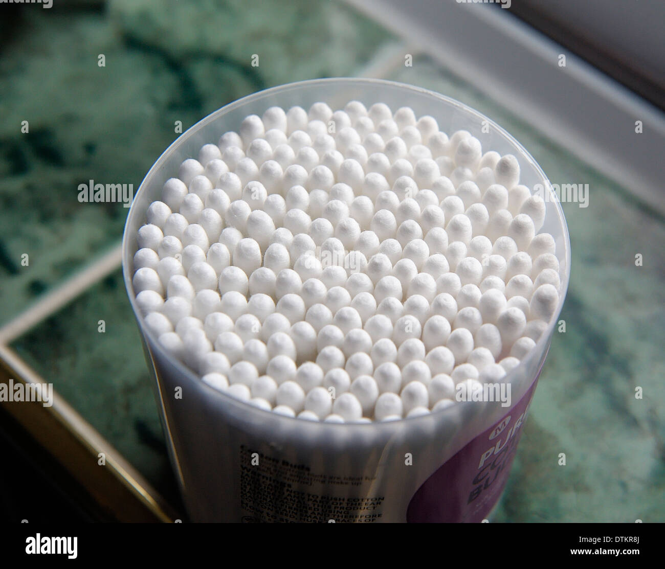 A tub of cotton ear buds Stock Photo