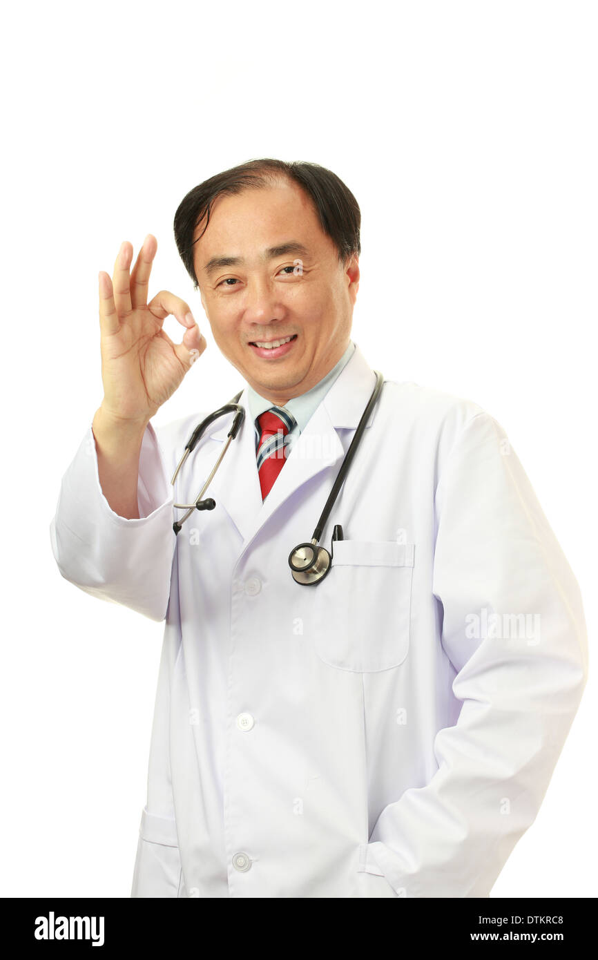 Asian male doctor smiling at the camera in uniform Stock Photo - Alamy