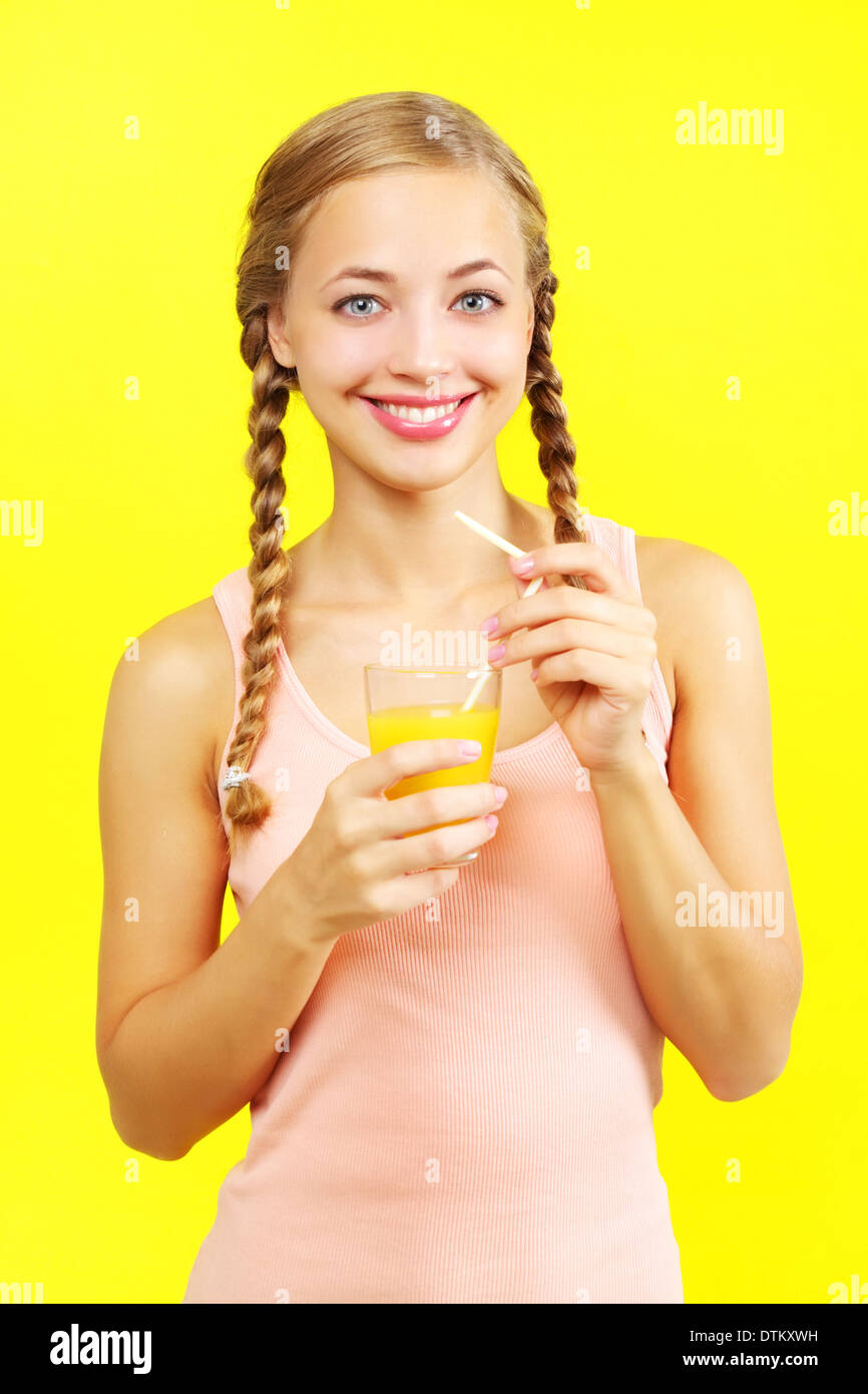 Teenager girl drinking orange juice Stock Photo Alamy