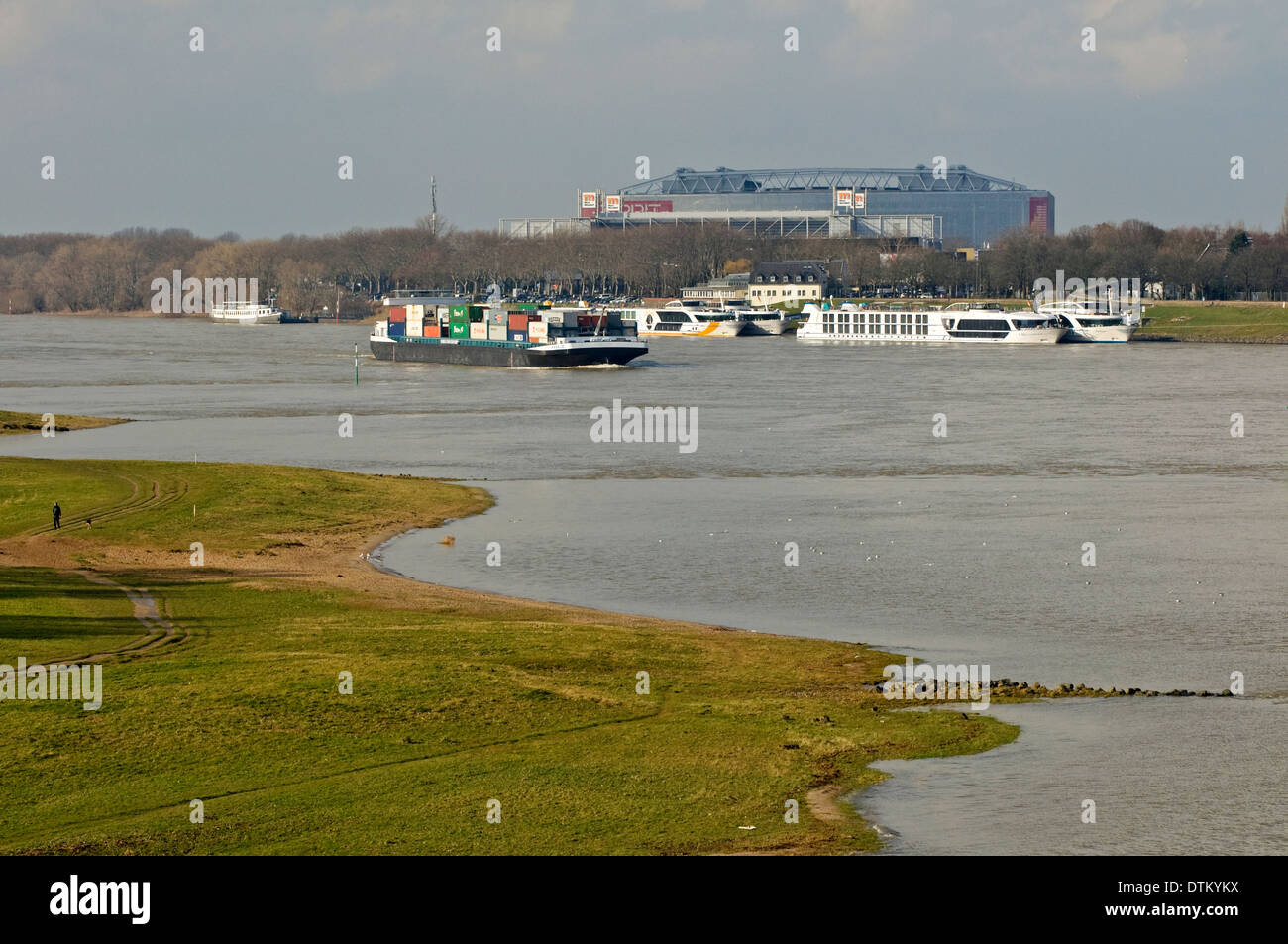 View over the Rhine Meadows to the Arena & Trade Fair Halls with Hotel  Boats, Düsseldorf, NRW, Germany Stock Photo