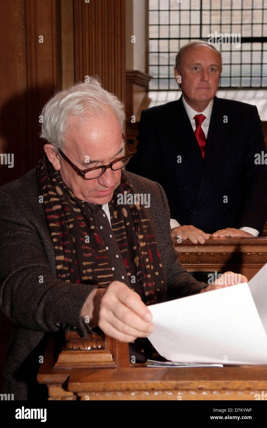 London, UK. 20th February 2014. Actor Simon Callow read Dickens at a service to mark the 150th Anniversary of the Journalists' Charity at St Bride's Fleet `Street (the journalist's church). Charles Dickens was one of the charity's founders, and Callow is an acknowledged expert on the Victorian author. In background Paul Dacre, editor-in-chief Daily Mail Stock Photo