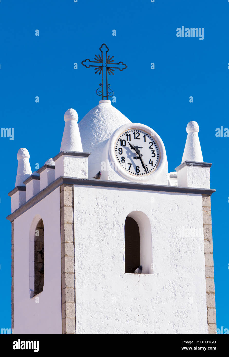Clock and bell tower, Igreja de Nossa Senhora da Conceicao, Conceicao de Tavira, Algarve, Portugal, February 2014 Stock Photo
