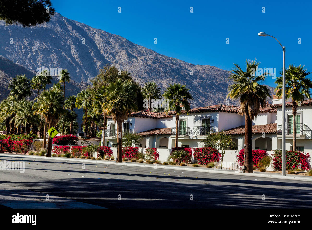 Condominiums bedecked with Bougainvillea in Palm Springs California February 2014 on Palm Canyon Drive Stock Photo