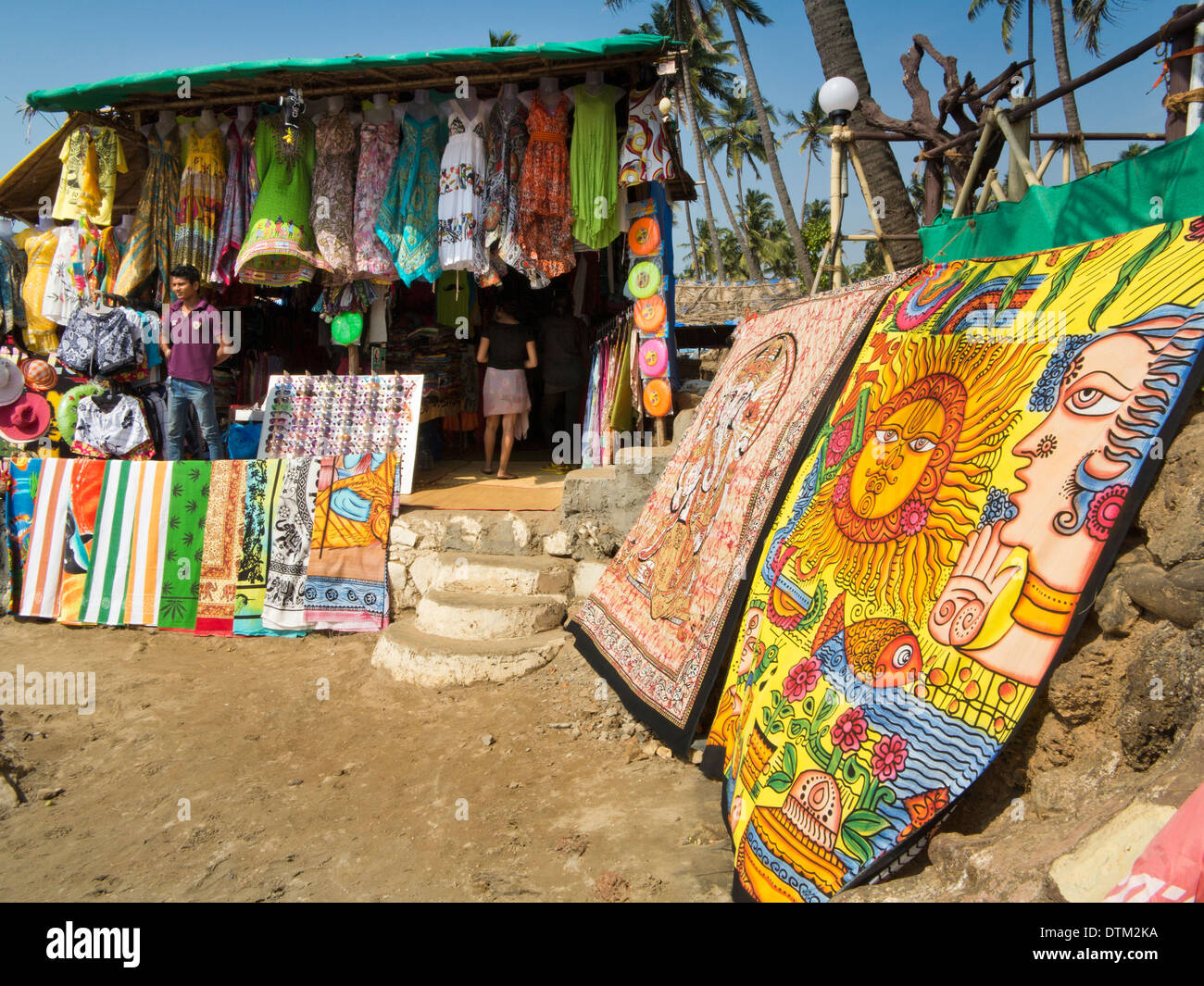 India, Goa, Vagator Beach, textile stall, selling, clothes, sarongs and mats Stock Photo