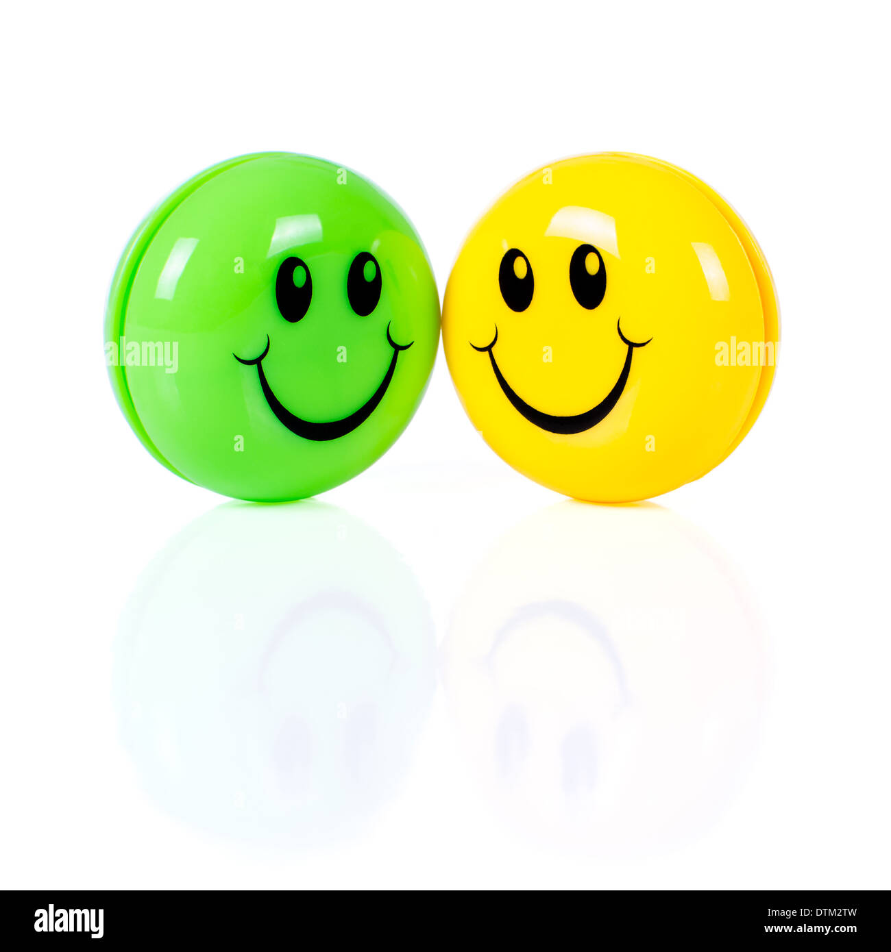 Yellow and green smileys isolated on white background Stock Photo