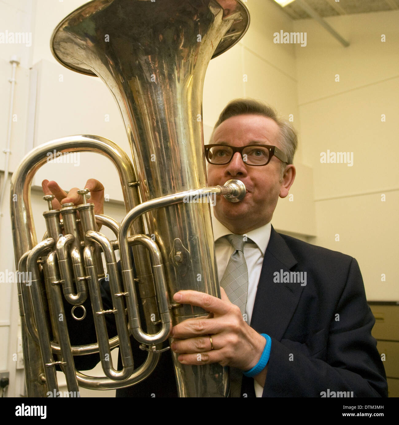 Former Secretary of State for Education Michael Gove MP playing the tuba in music class whilst on a school visit, Liphook, Hampshire, UK. Stock Photo