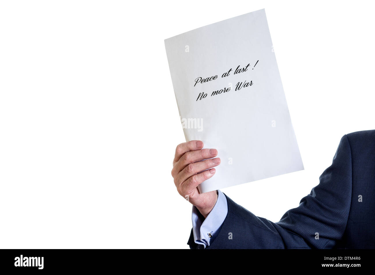 Man holding a sheet of white paper. 'Peace at last! No more war' quote. Stock Photo