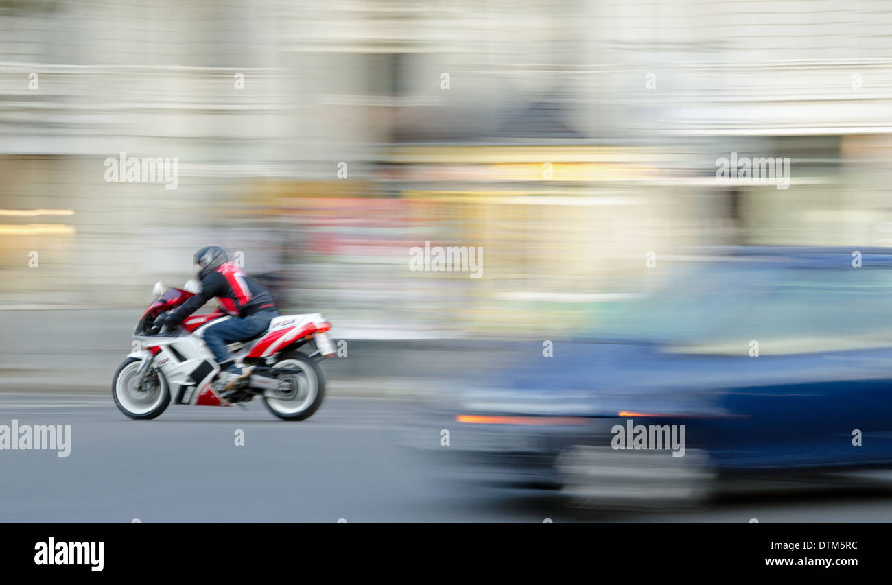 motorcyclist in city traffic. Stock Photo