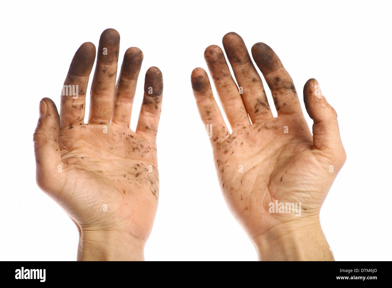 Color shot of two dirty hands, isolated on white. Stock Photo
