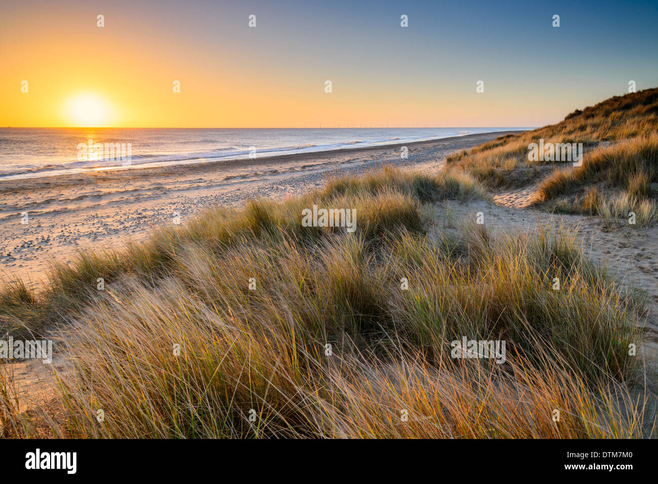 Morning sunrise over coast at Winterton Beach in the National Nature Reserve, Winterton on Sea, East Coast, Norfolk, UK. Stock Photo