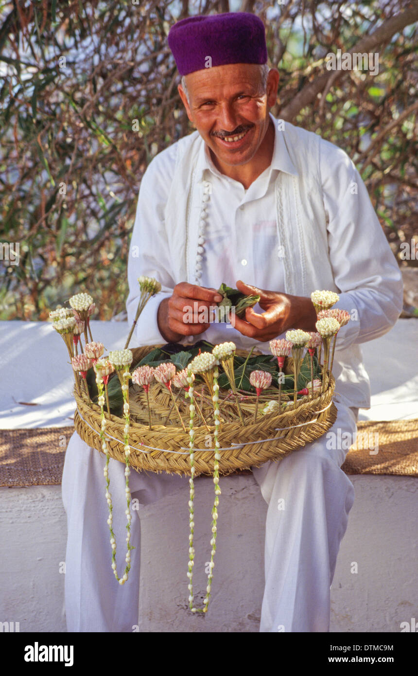 Tunisia, Sidi Bou Said. Jasmine Seller Bahri Mabrook, in Traditional Tunisian Men's Clothing. Stock Photo