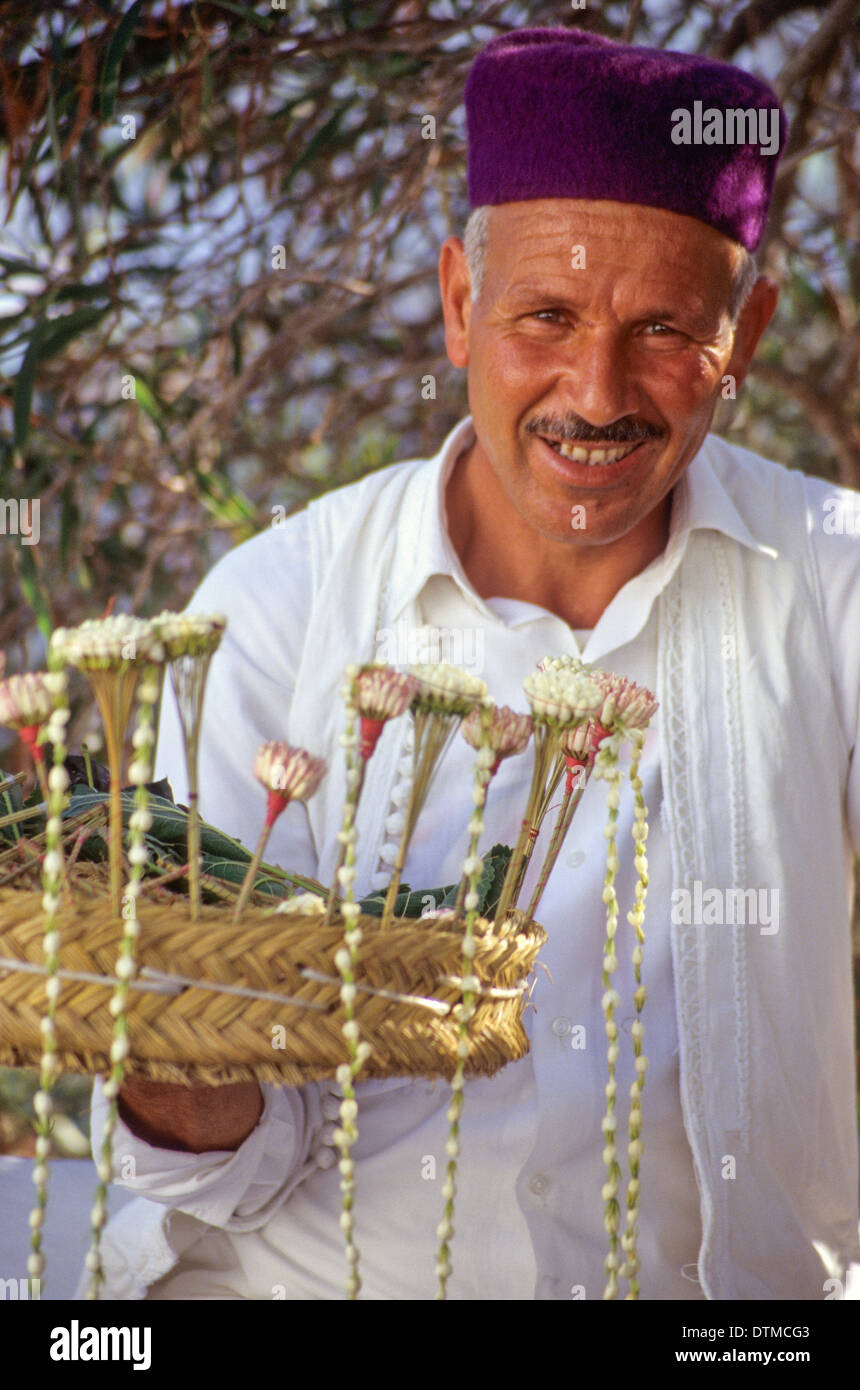 Tunisia, Sidi Bou Said. Jasmine Seller Bahri Mabrook, in Traditional Tunisian Men's Clothing. Stock Photo