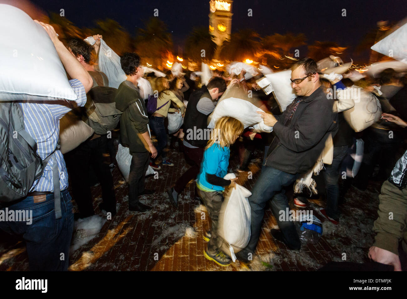 Evasive moves during Valentines Day pillow fight fun in San Francisco Stock Photo