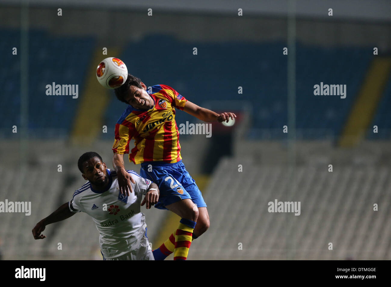 Nicosia, Cyprus. 20th Feb 2014. Dinamo Kiev's Jeremain Lens fight  for the ball with  Valencia Ricardo Costa during their Europa League  soccer match at GSP stadium. Credit:  Yiannis Kourtoglou/Alamy Live News Stock Photo