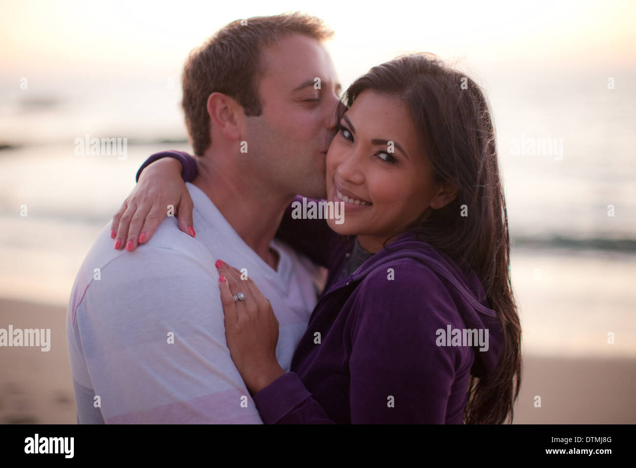 Couple Hold Hands And Smile As The Are About To Kiss At The Beach Stock Photo Alamy Couple Hold Hands And Smile As The Are About To Kiss At The Beach Stock Photo Alamy