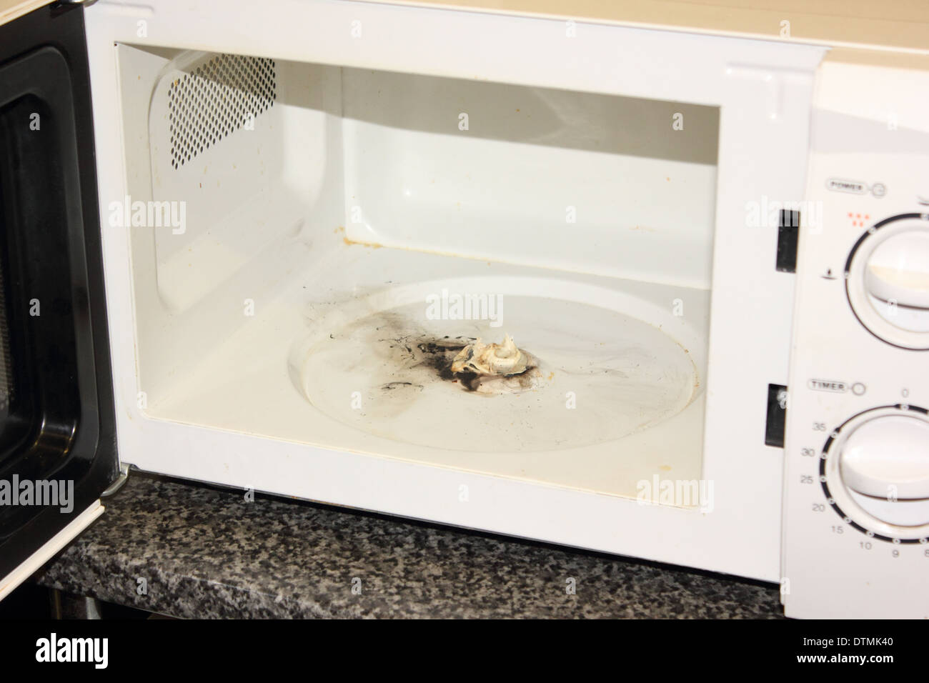 https://c8.alamy.com/comp/DTMK40/a-microwave-that-caught-on-fire-DTMK40.jpg