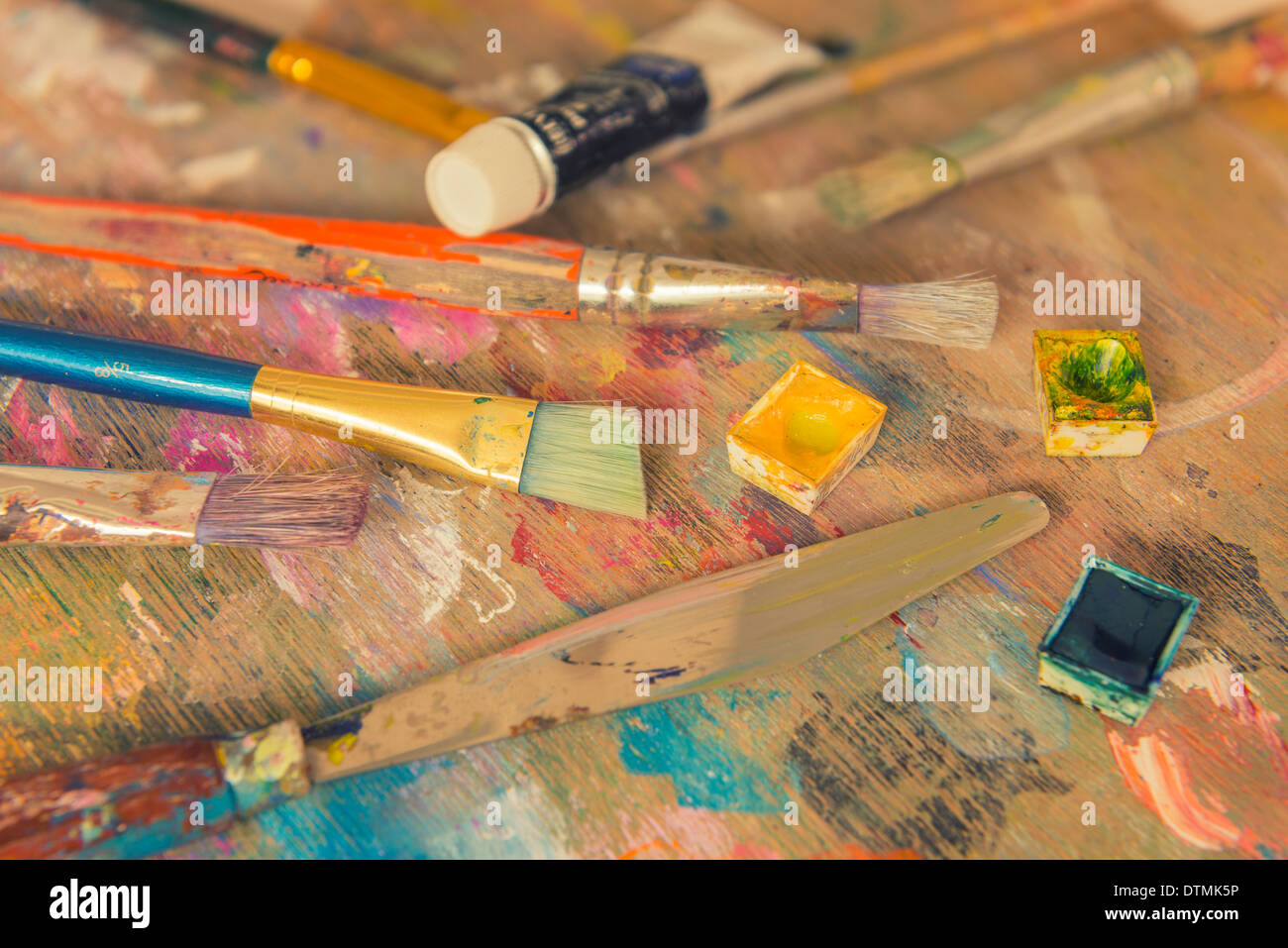 A small collection of art material on a wooden palette Stock Photo