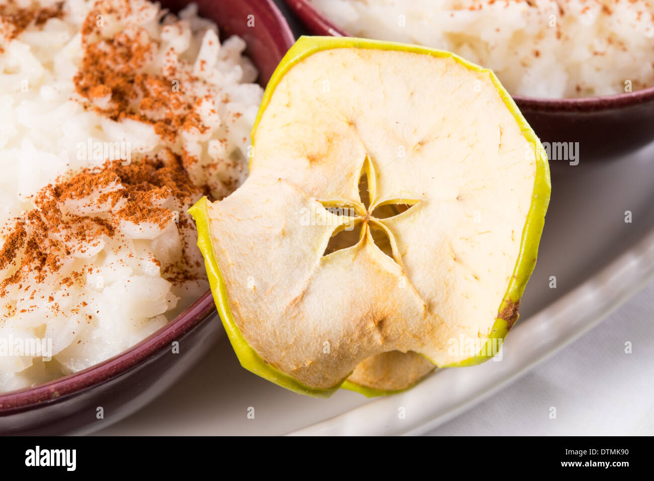 milk rice with cinnamon and applesauce Stock Photo Alamy
