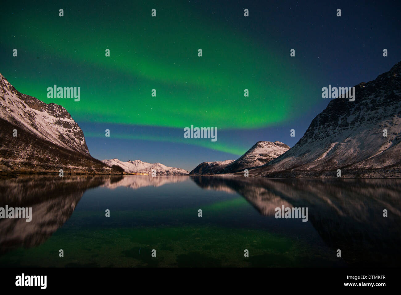 Aurora Borealis, reflected in a fjord near Tromso in Norway Stock Photo ...