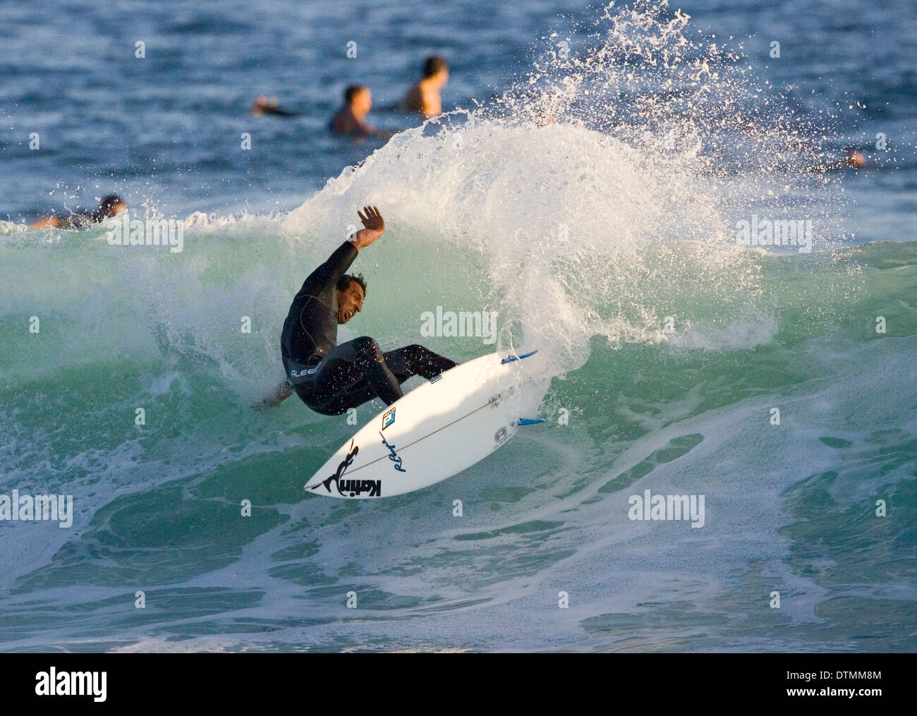 surfer on a surfboard riding a wave in the ocean sea water wave beach