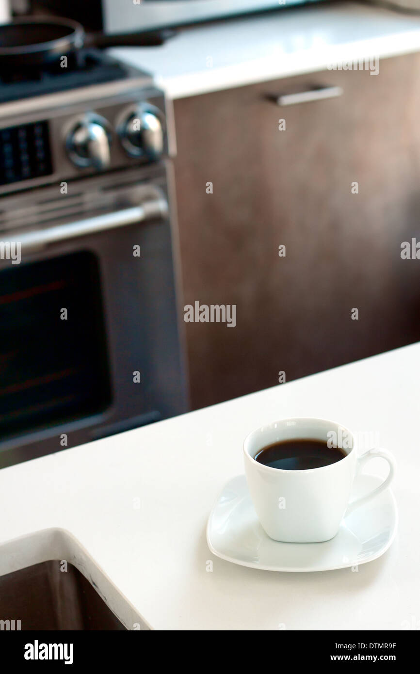 Cup of coffee in kitchen. Stock Photo