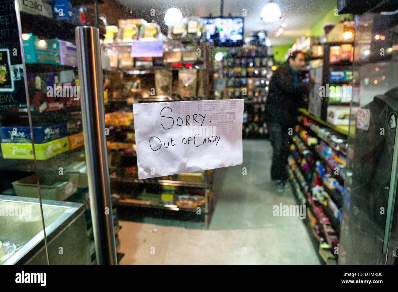 During Halloween night, note on the store door: Sorry Out of Candy Stock Photo