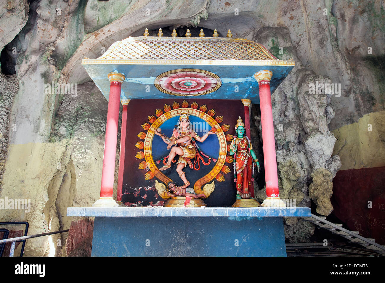 Shrine with Statue of Indian Hindu Dancing God Shiva Nataraja at Batu Caves in Malaysia Stock Photo