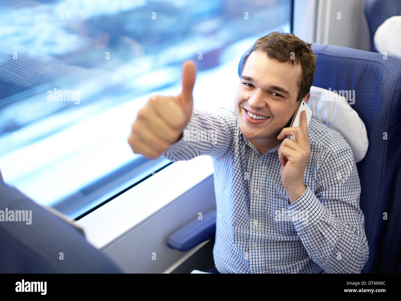 Young successful businessman in the train. Stock Photo