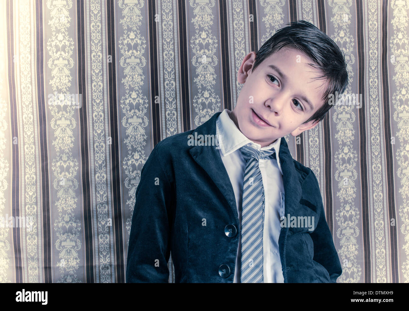 Boy in vintage black suit and tie Stock Photo
