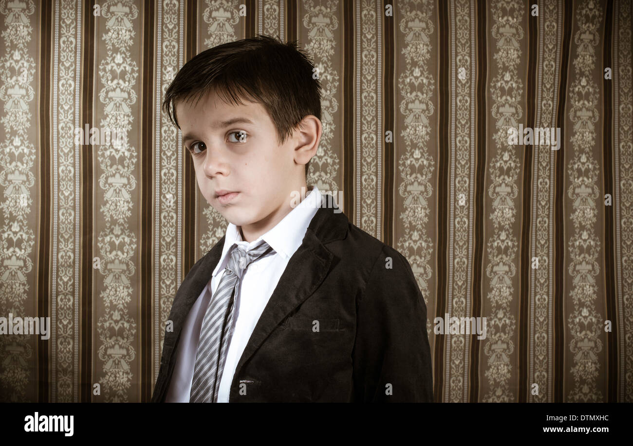 Boy in vintage black suit and tie Stock Photo