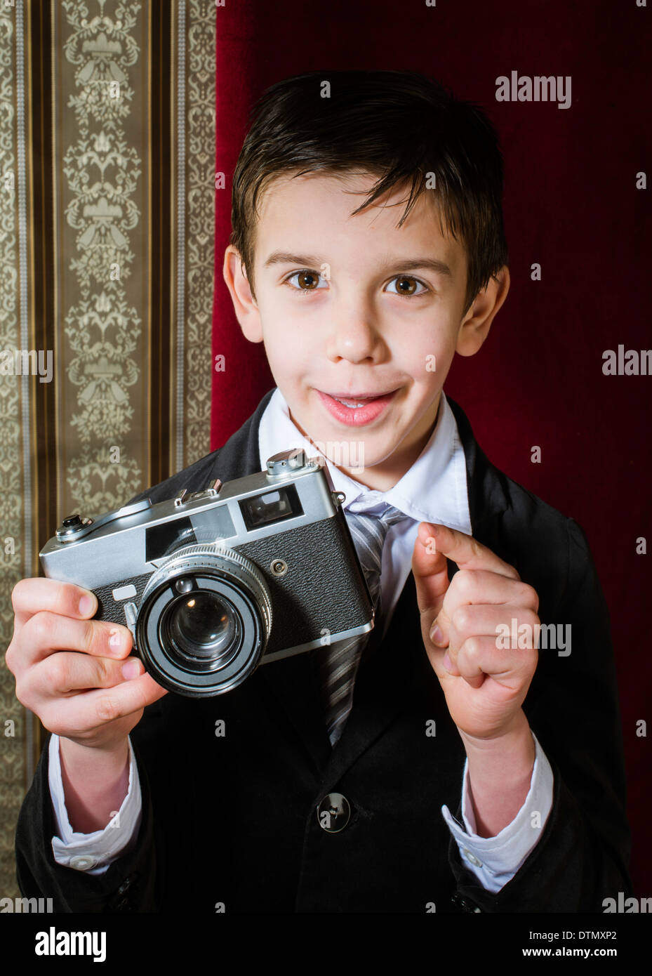 Boy with vintage camera. Vintage clothes Stock Photo - Alamy