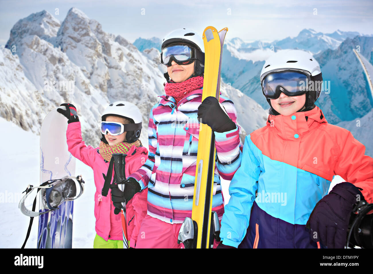 two teenage girl and a woman skiing alpin in the mountains Stock Photo