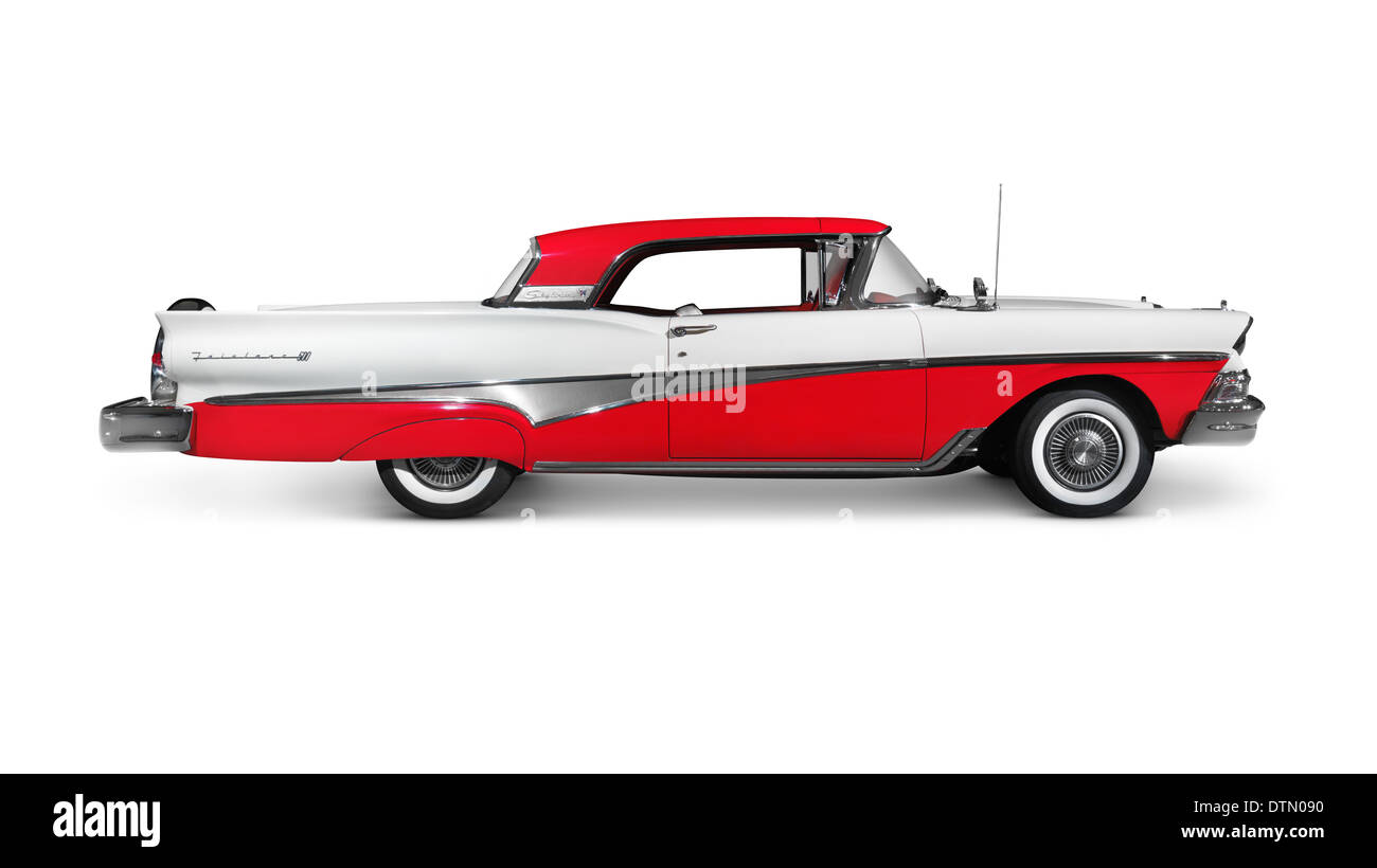 License and prints at MaximImages.com - Red and white 1958 Ford Fairlane 500 Skyliner classic retro car side view isolated on white background Stock Photo