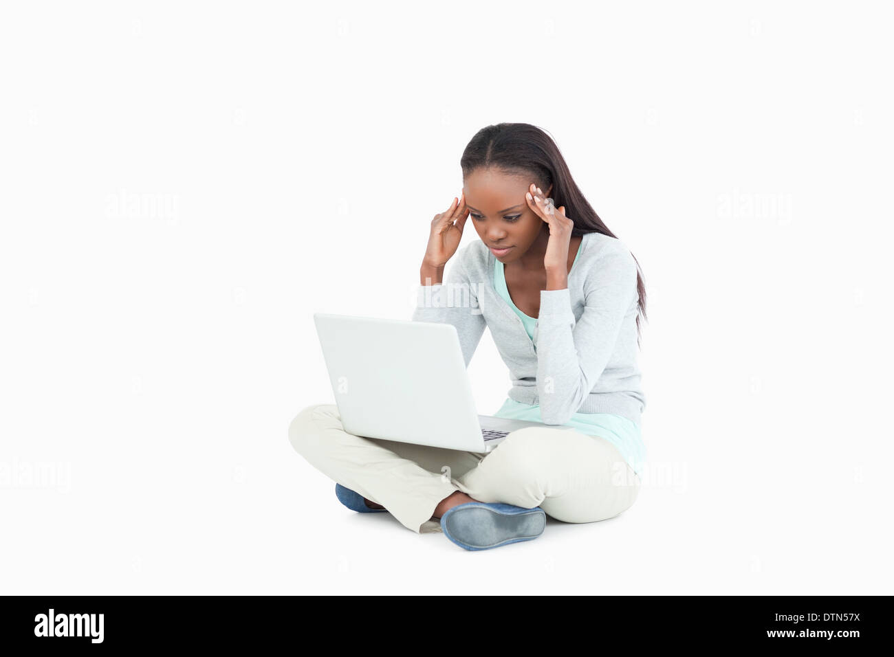Laptop giving young woman a headache Stock Photo Alamy