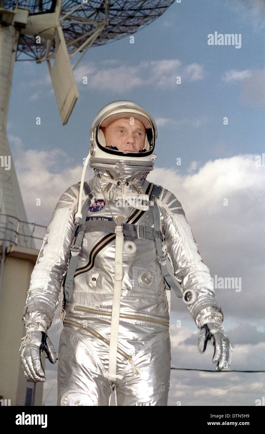 US astronaut John Glenn Jr., pilot of the Mercury Atlas 6 spaceflight, poses for a photo in his silver space suit during preflight activities February 27, 1964 at the Kennedy Space Center, Florida. Glenn piloted the spacecraft on the first manned orbital mission of the United States completed a successful three-orbit mission around the earth on Feb. 20, 1962. Stock Photo