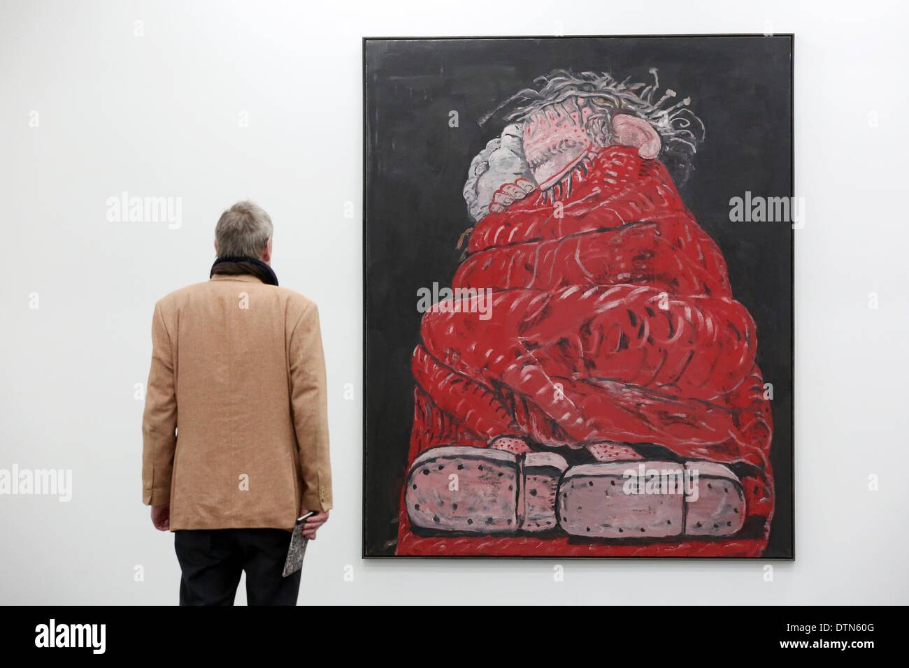 Hamburg, Germany. 21st Feb, 2014. A visitor looks at the work 'Sleeping' by US painter Philip Guston (1913-1980) in the exhibition rooms of the collection Falkenberg in Hamburg, Germany, 21 February 2014. The Hamburg Deichtorhallen present the exhibition 'Philip Guston - The great late work' from 22 February until 25 May 2014. Photo: BODO MARKS/dpa/Alamy Live News Stock Photo