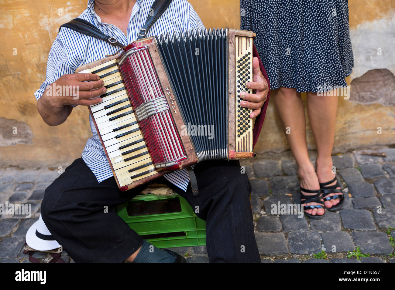 Street musician playing accordion Stock Photo