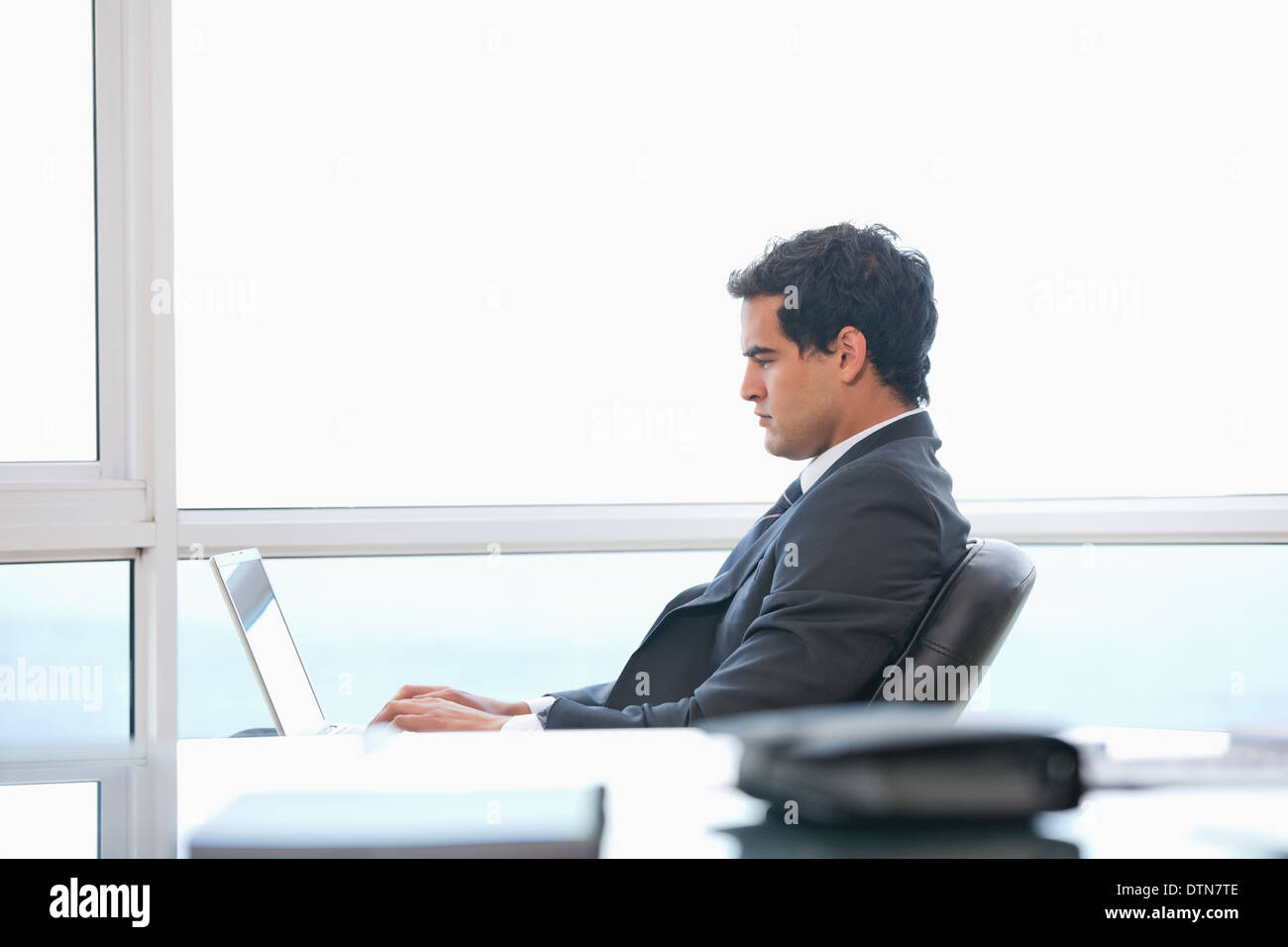 Man typing on a computer Stock Photo - Alamy