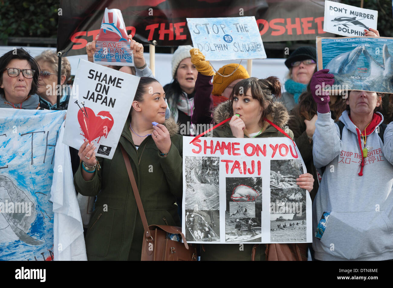 Piccadilly, London, UK. 21st Feb 2014.  Protesters stage a demonstration outside the Embassy of Japan in London, against the slaughter and capture of dolphins and small whales in Japan. The dolphin drive hunt in Taiji, takes place every year from September to April. Credit:  Lee Thomas/Alamy Live News Stock Photo