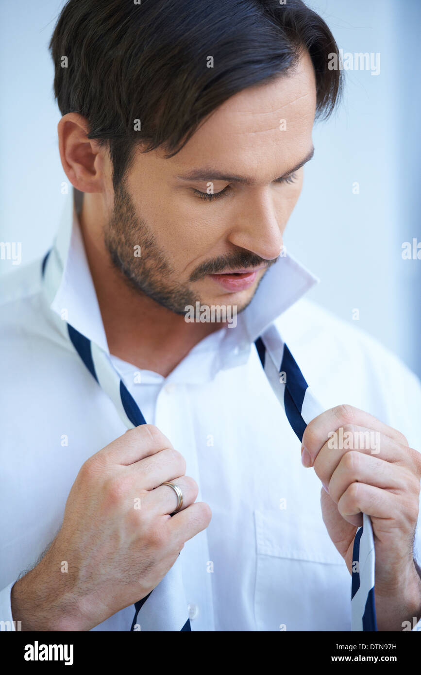 putting on a tie